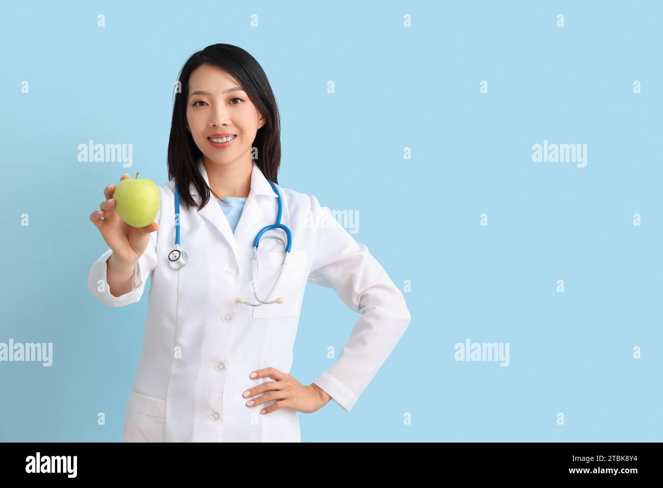 Female asian nutritionist apple hi-res stock photography and images - Alamy
