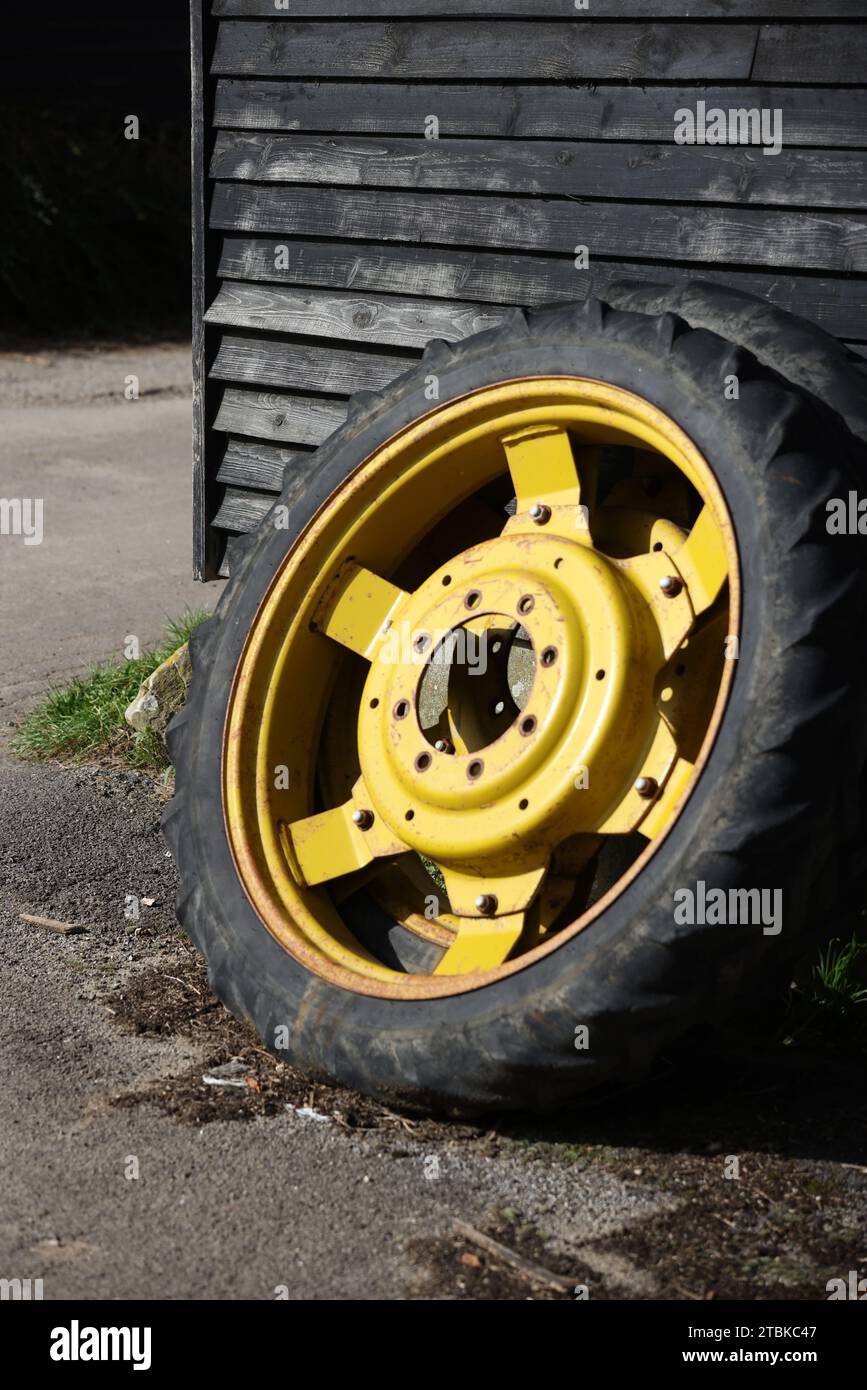Tractor wheel pictured on a farm in Chichester, West Sussex, UK. Stock Photo