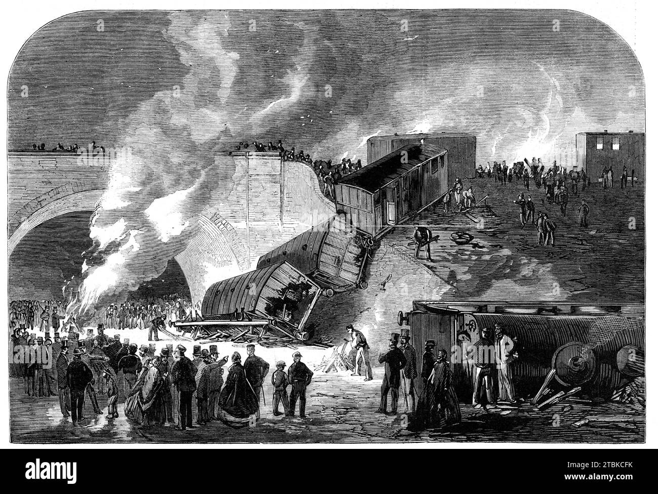 Fatal railway accident at Kentish-Town, on the north and south western junction line: scene of the disaster on Monday night, 1861. A ballast-train was struck by a passenger train. The engine '...leaped from the rails...and rolled down the embankment...with a hideous dull sound and...frightful screeches...four carriages, in which were a number of passengers [followed]...The moans of the dying, the cries of the wounded, and the lamentations of those who missed their relatives, were to be heard on every side...Men were engaged in dragging corpses from under wheels...Many ladies ran about with lin Stock Photo