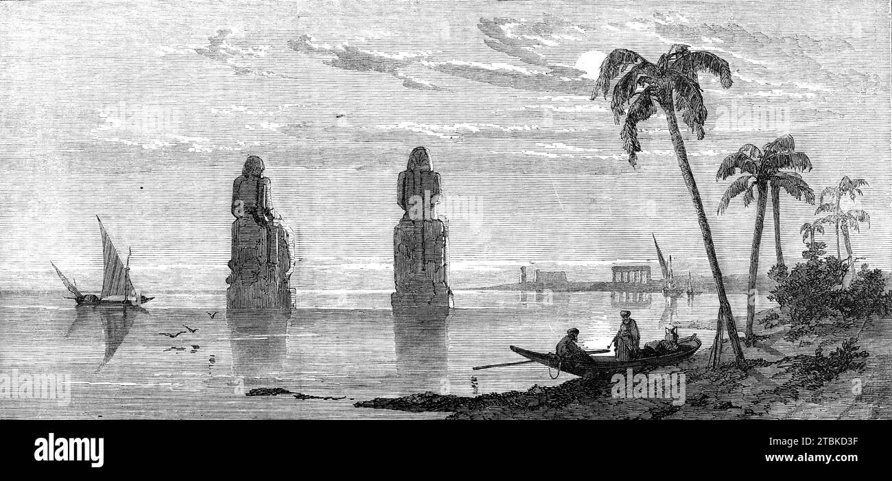 Inundation of the Nile: colossal statues in the Plain of Thebes, 1861. 'The stupendous remains of this famous city of antiquity, long the capital of Egypt, extend for seven miles along both banks of the Nile, in Upper Egypt, and present an imposing collection of ancient monuments...[shown here are] two enormous sitting colossi, one of which was the celebrated Memnon...Egypt owes, as is well known, its existence as a productive and habitable region to the Nile, the periodic overflowings of which more than answer the purpose of rain in other countries; and, accordingly, in olden times the benefi Stock Photo