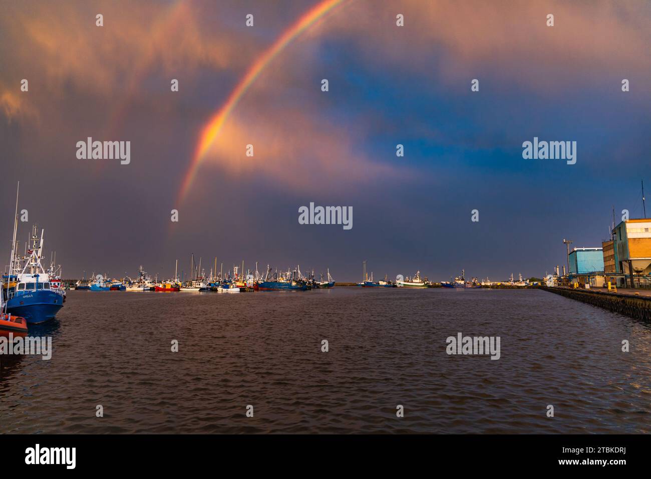Wladyslawowo, Poland - July 24 2023: Beautiful double rainbow over boats docked at the port after long storm over the Baltic sea Stock Photo