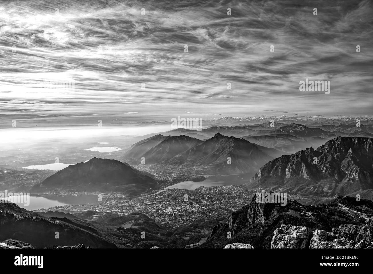 View of Lecco and the alps from Mount Resegone in black and white Stock Photo