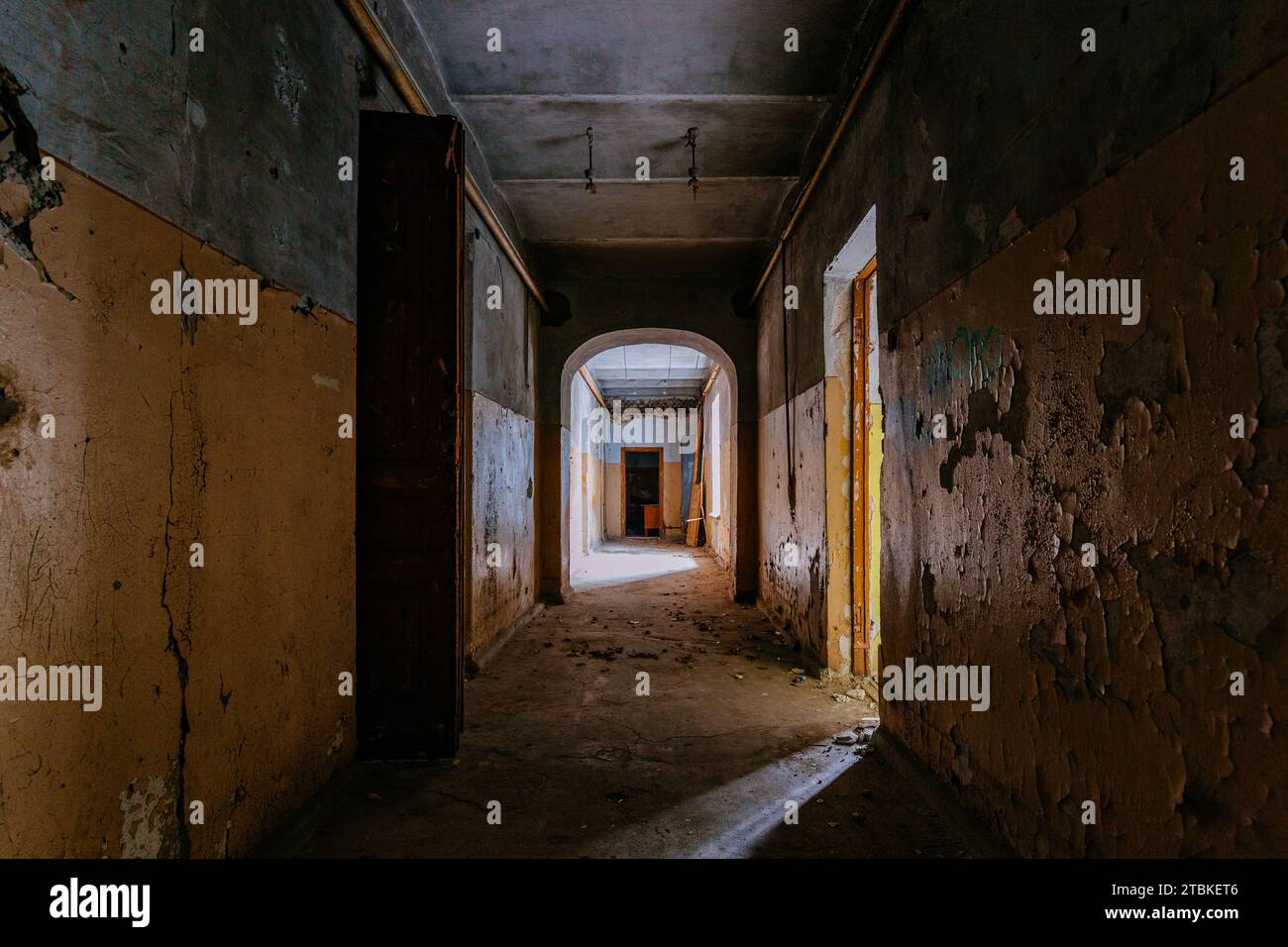 Dark vaulted corridor in old abandoned building. Stock Photo
