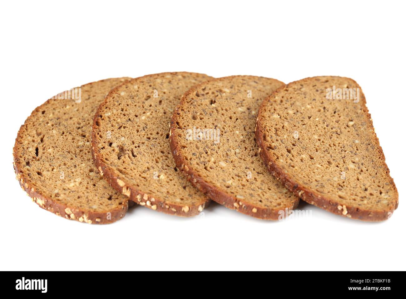 Bread slices with sunflower seeds and oat flakes isolated on white background. Stock Photo