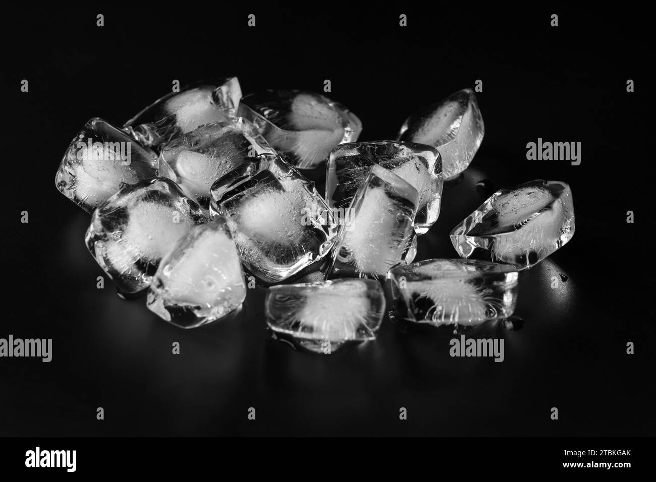 Ice cubes isolated on black background Stock Photo - Alamy
