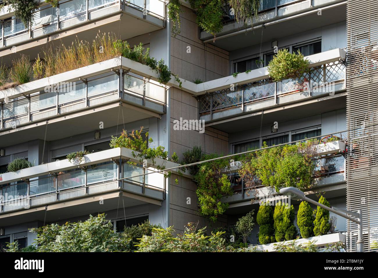 Barcelona's Eco-Friendly Marvel: Multilevel apartment building adorned with lush balconies, a green facade symbolizing sustainability in the heart of Stock Photo
