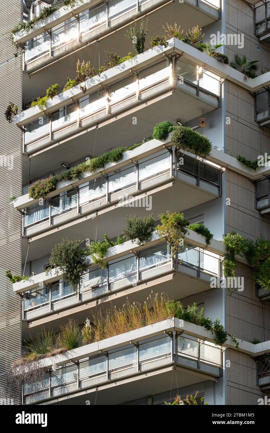 Barcelona's Eco-Friendly Marvel: Multilevel apartment building adorned with lush balconies, a green facade symbolizing sustainability in the heart of Stock Photo