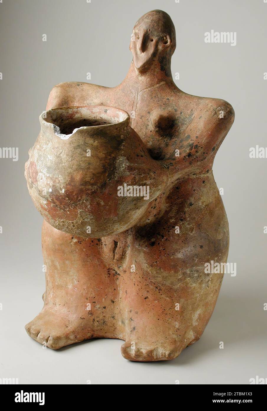 Female Figurine Holding Jar Stock Photo Alamy