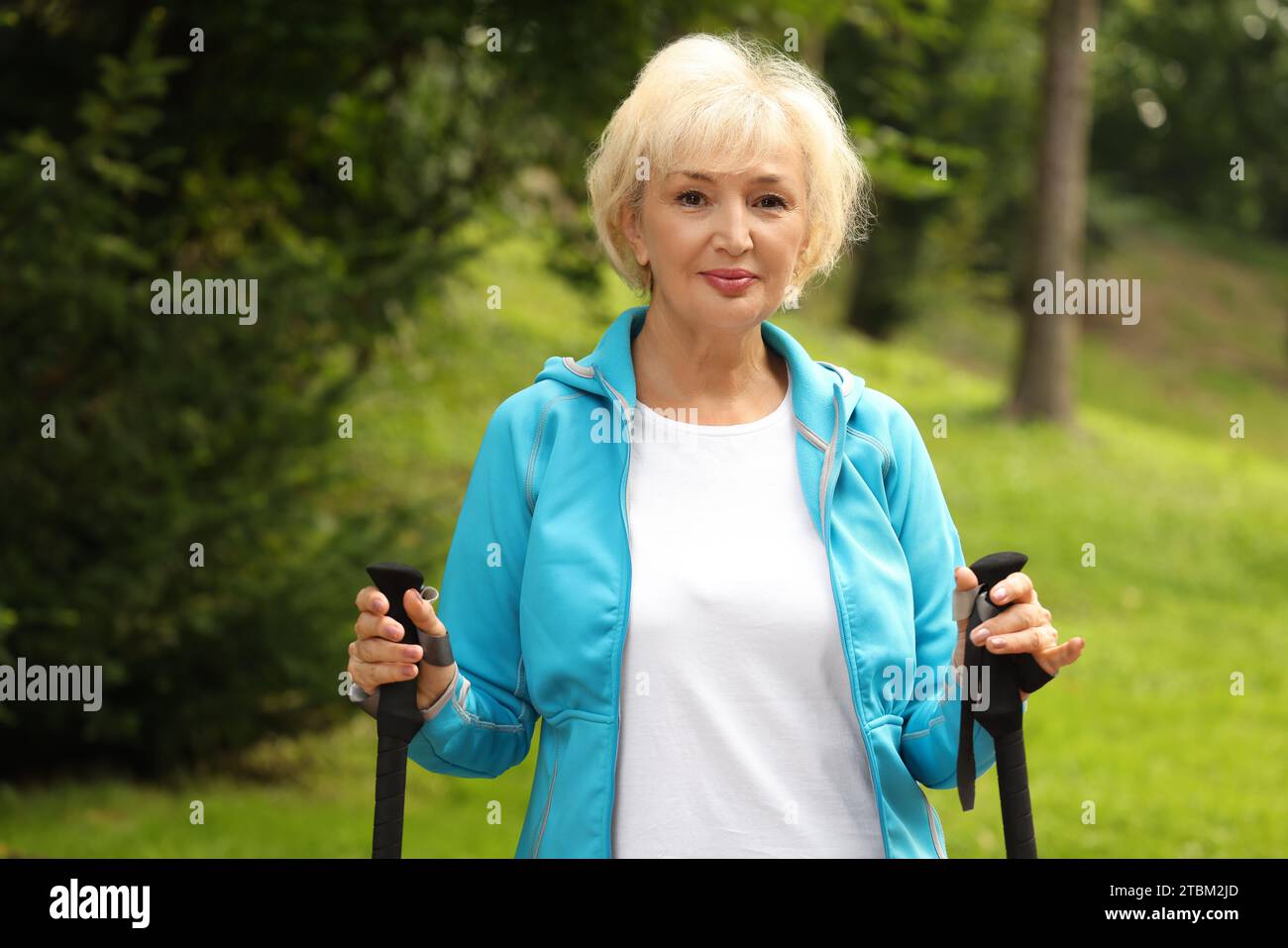 Blonde mature woman nordic walking hi-res stock photography and images ...