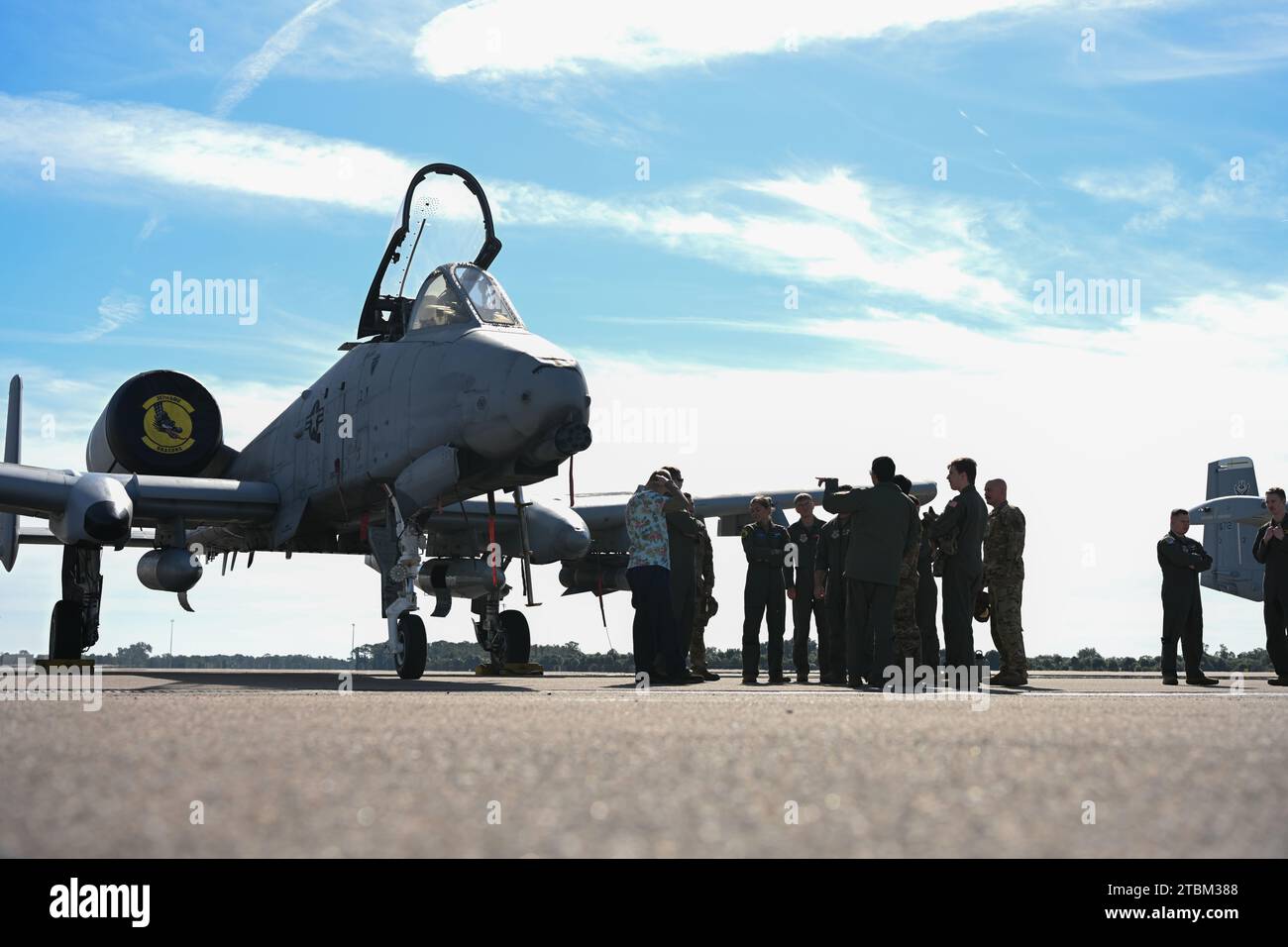 U.S. Air Force Airmen assigned to the 91st Air Refueling Squadron tour an A-10C Thunderbolt II assigned to the 357th Fighter Squadron, Davis-Monthan Air Force Base, Arizona, at MacDill AFB, Florida, Dec. 7, 2023. The boom operators were offered a tour of the aircraft to familiarize themselves with an aircraft they usually only see flying. (U.S. Air Force photo by Airman 1st Class Derrick Bole) Stock Photo