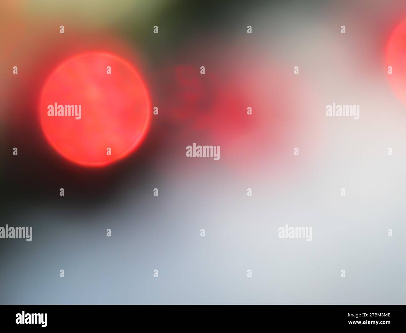 Defocused bokeh lights for backdrop. Red circles of light. Abstract and Christmas background Stock Photo