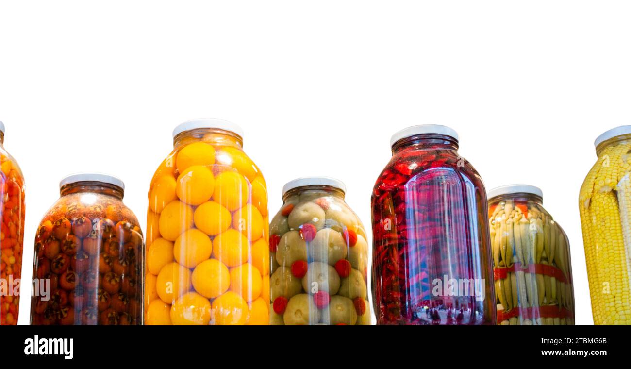 Jars preserved vegetables. Canned food in glass jars. Grocery conserve