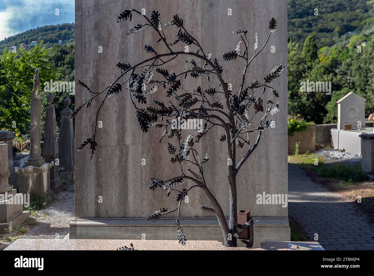 Metal sculpture on a grave, Monumental Cemetery, Cimitero monumentale di Staglieno), Genoa, Italy Stock Photo