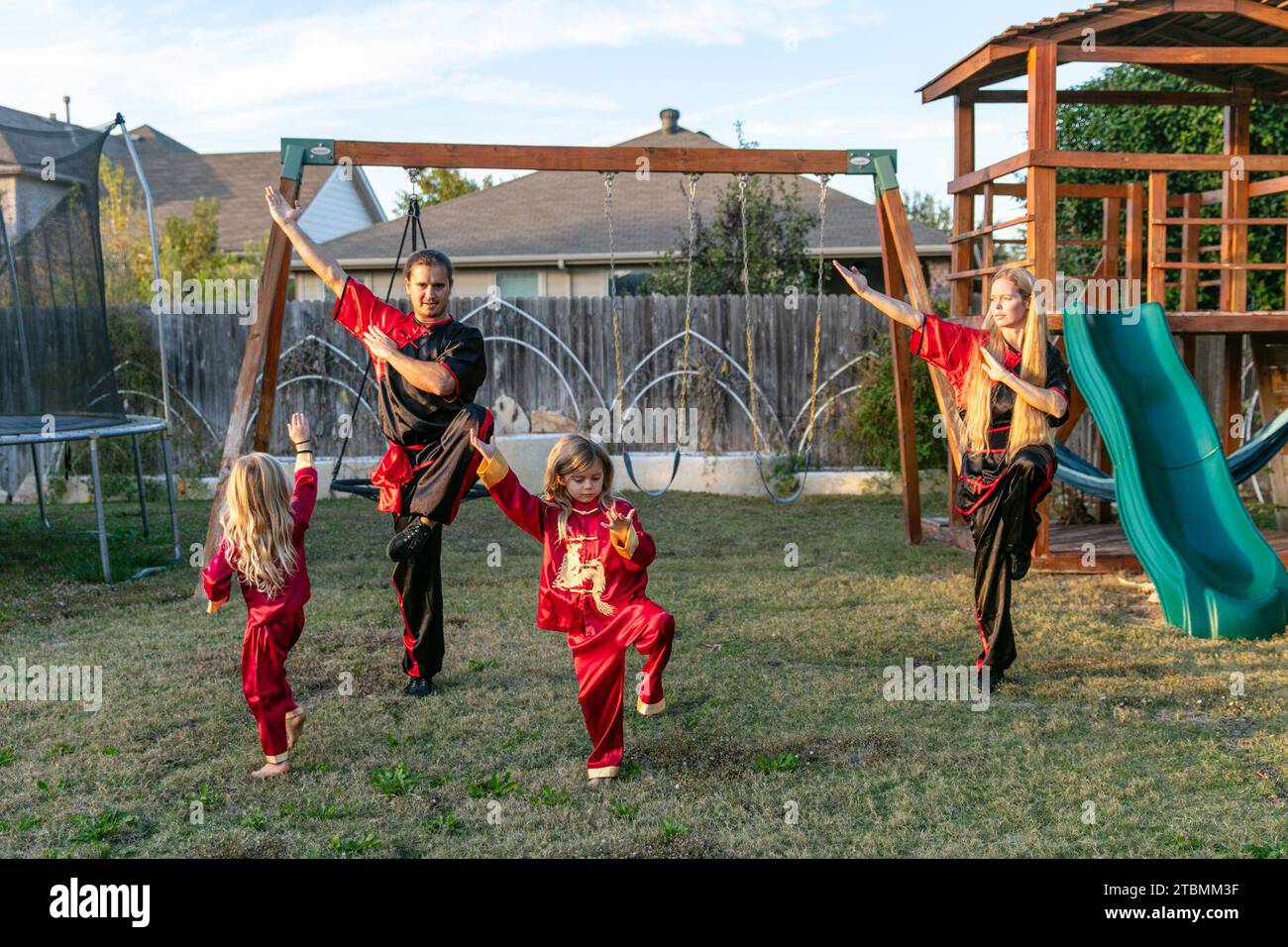 Fort Worth, USA. 18th Nov, 2023. David Saucedo (2nd L) and his wife Angela Saucedo (1st R) practice Wushu with their children at the backyard of their home, in Fort Worth, Texas, the United States, Nov. 18, 2023. TO GO WITH 'Feature: Love journey of U.S. Wushu family' Credit: Tian Dan/Xinhua/Alamy Live News Stock Photo
