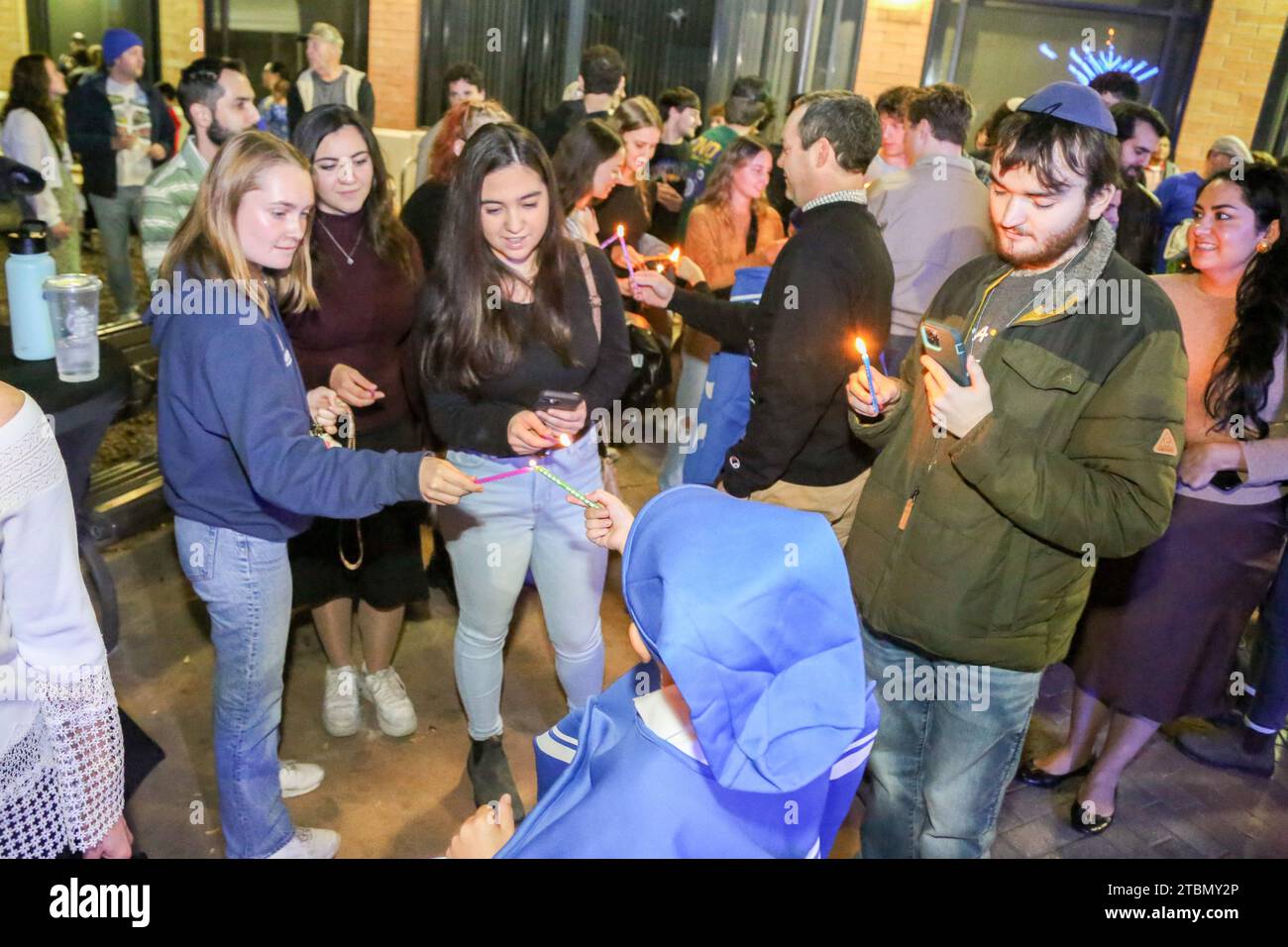 Candles are lit so that they can be passed around to the crowd that