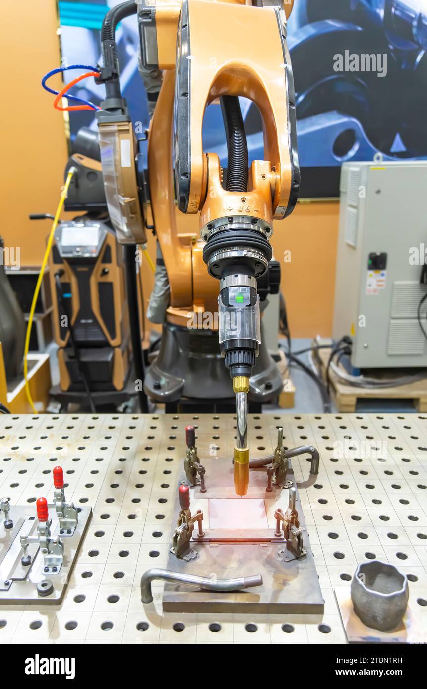 Welding robot in the process Stock Photo