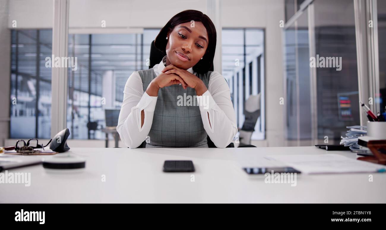 An African Woman's Patient Wait for a Mobile Phone Call Stock Photo - Alamy