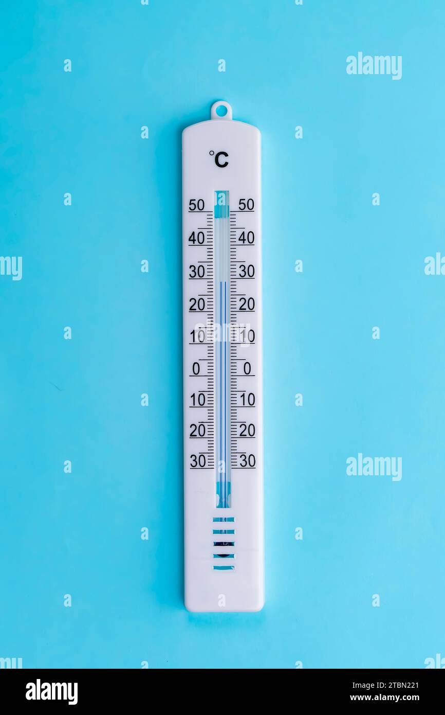https://c8.alamy.com/comp/2TBN221/thermometer-hanging-on-a-blue-background-2TBN221.jpg