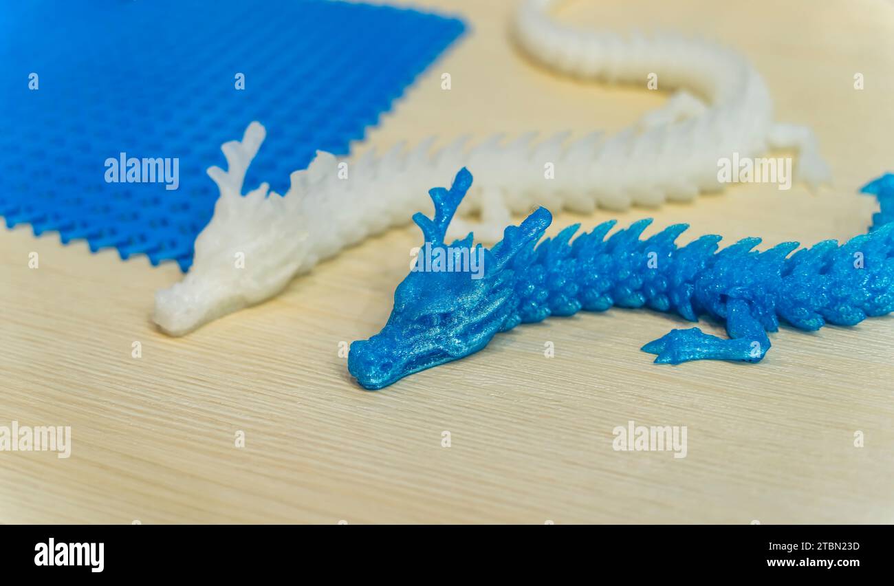 3D printer printing dragon head figure close-up Stock Photo - Alamy