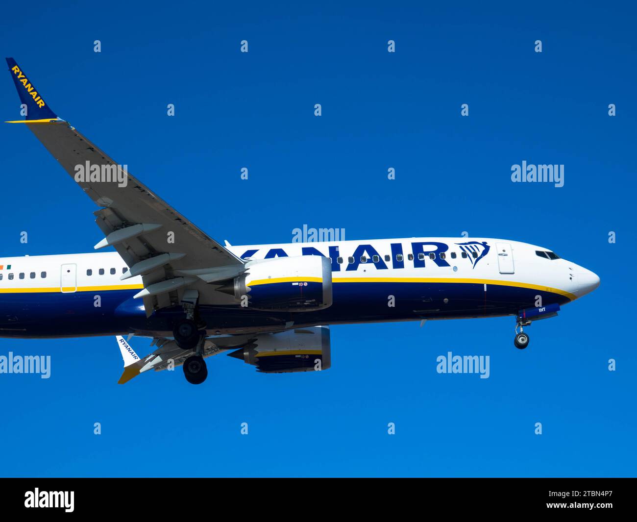 Airplane from the Ryan Air on approach for landing. Blue sky. Close up. November 08, 2023. Arrecife, Canary Island, Spain Stock Photo