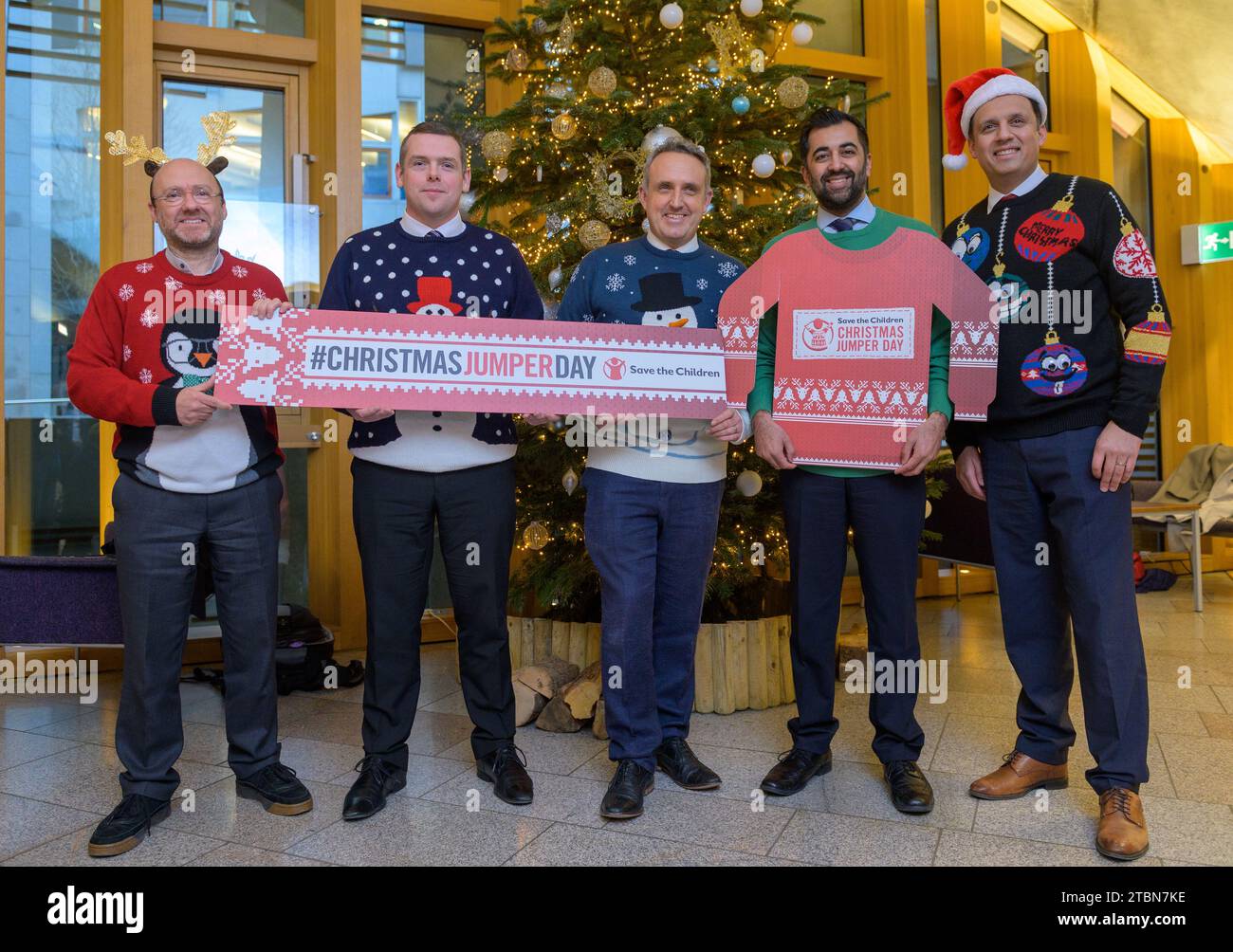 All images © Sandy Young Photography  Save the Children Christmas Jumper Day. PICTURED Party leaders at The Scottish Parliament wearing Christmas jumpers in support of Save the Children.  L-R Patrick Harvie Scottish Greens, Douglas Ross Scottish Conservatives, Alex Cole-Hamilton Lib Dems, Frist Minister Humza Yousaf SNP and Anas Sarwar Scottish Labour. Stock Photo