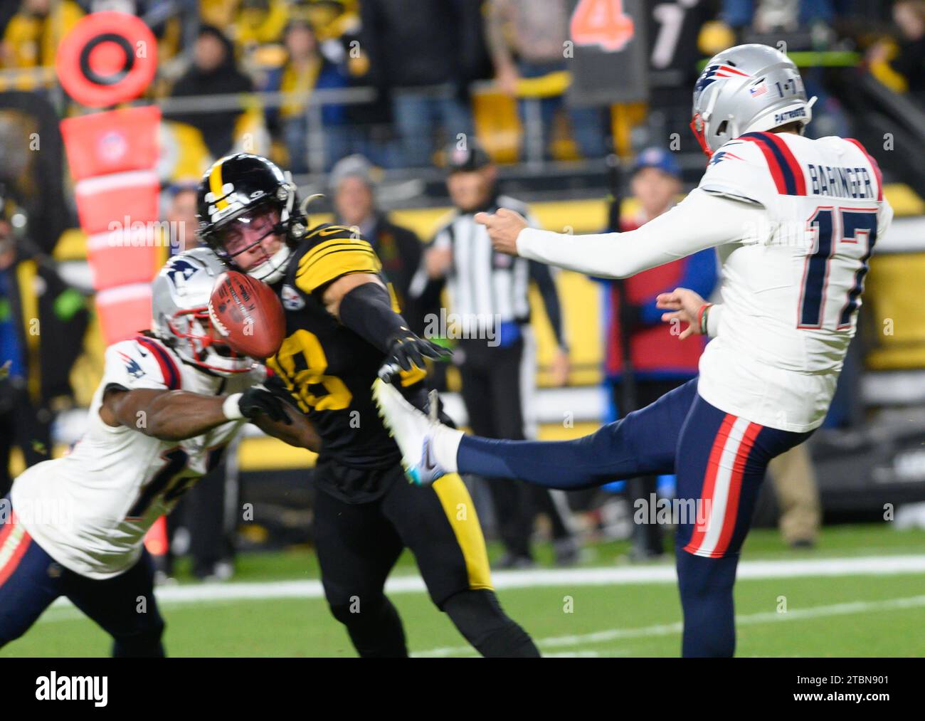 Pittsburgh, United States. 07th Dec, 2023. Pittsburgh Steelers safety Miles Killebrew (28) blocks the punt of New England Patriots punter Bryce Baringer (17) in the fourth quarter of the Patriots 21-18 win against the Steelers at Acrisure Stadium on Thursday, December 7, 2023 in Pittsburgh. Photo by Archie Carpenter/UPI Credit: UPI/Alamy Live News Stock Photo
