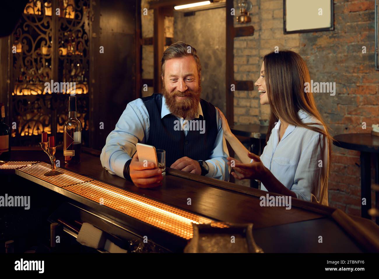 Man watching woman bar hi-res stock photography and images - Alamy