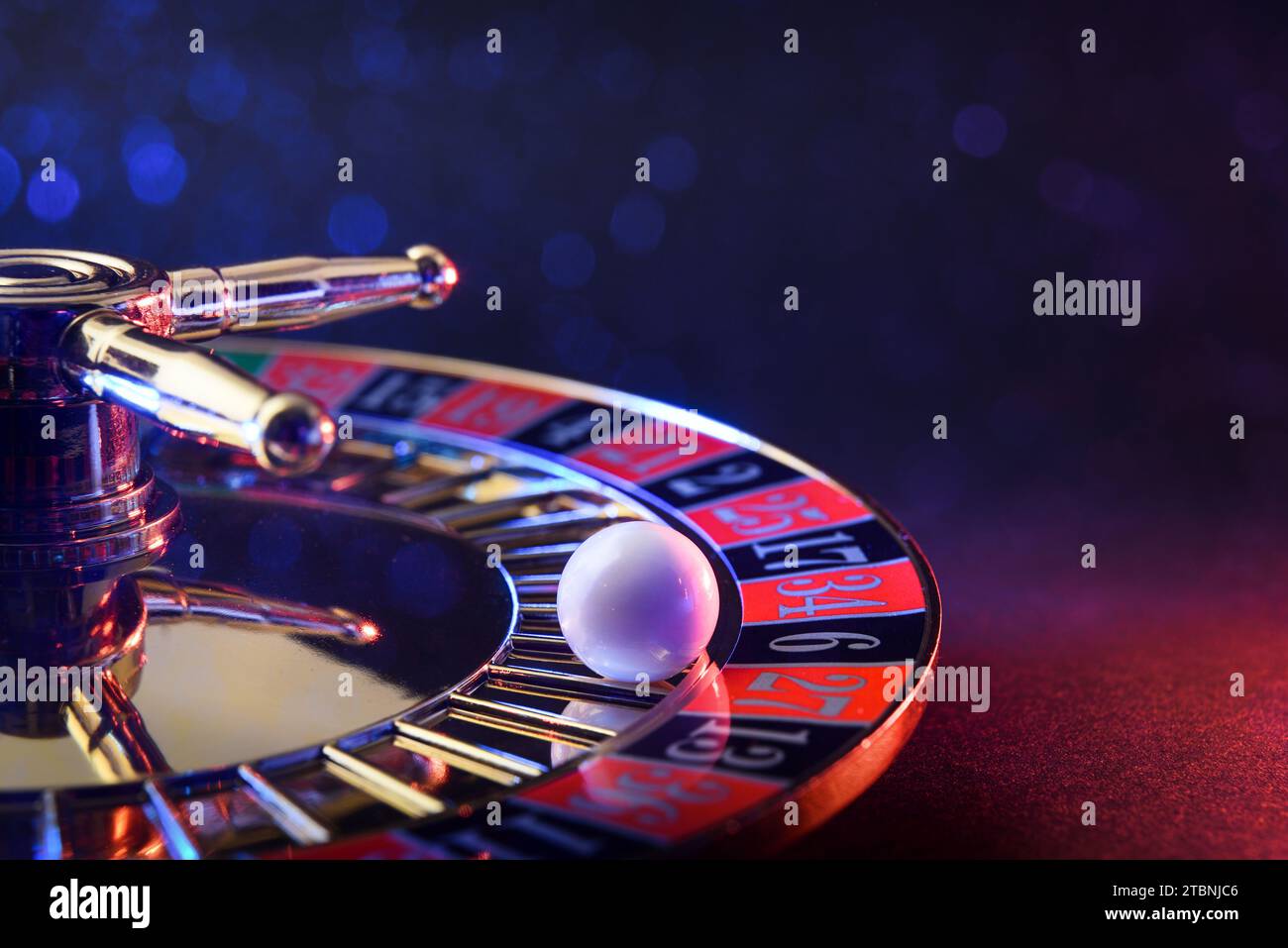 Detail of ball fixed on the black six of a casino roulette wheel on