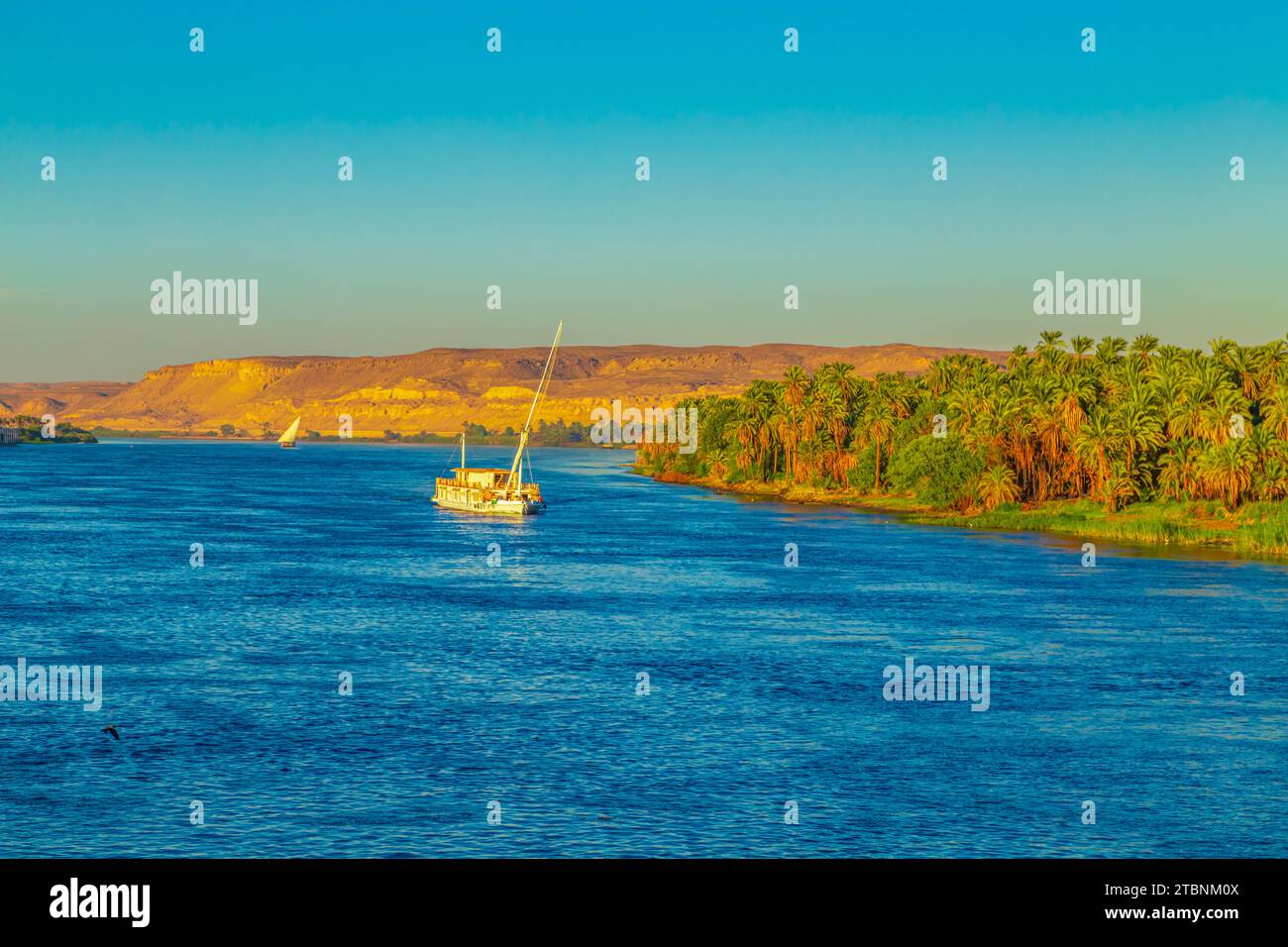 Traditional  boat on the Nile River. Magnificent views of the Nile at sunset. Aswan, Egypt - October 19, 2023. Stock Photo