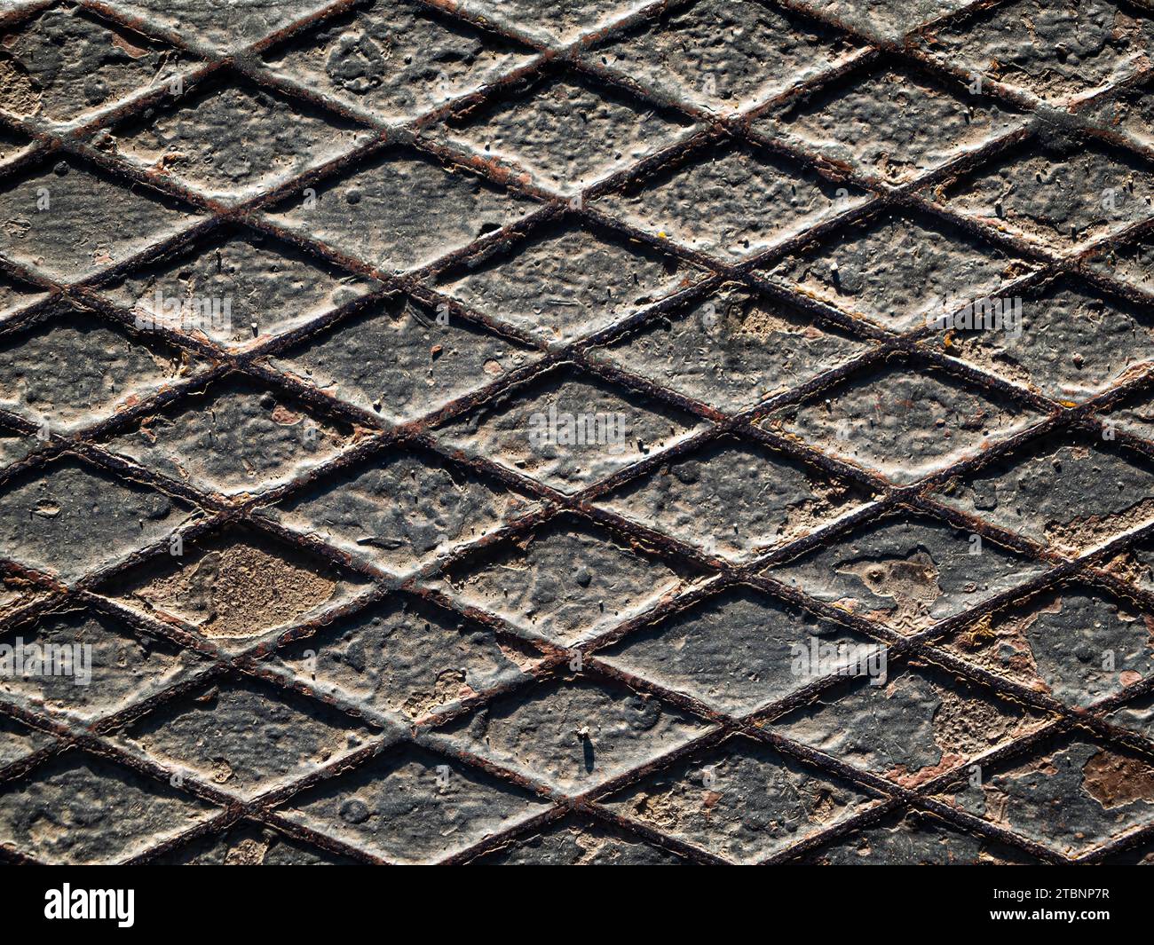Rusty old weathered diamond plate texture close up top down view, background copy space Stock Photo