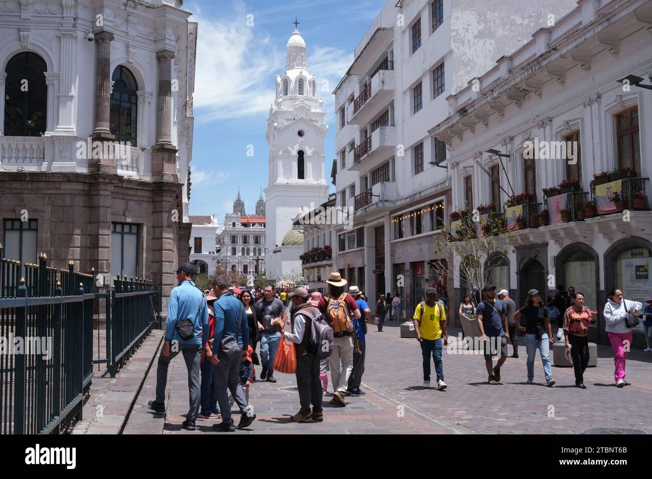 Typical busy street with white church, Quito Stock Photo