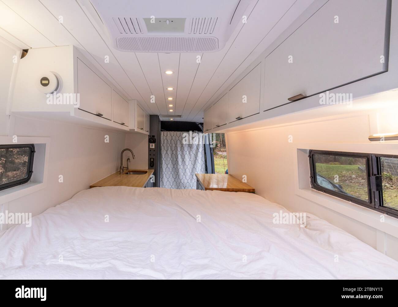 All white camper interior of a converted cargo van Stock Photo
