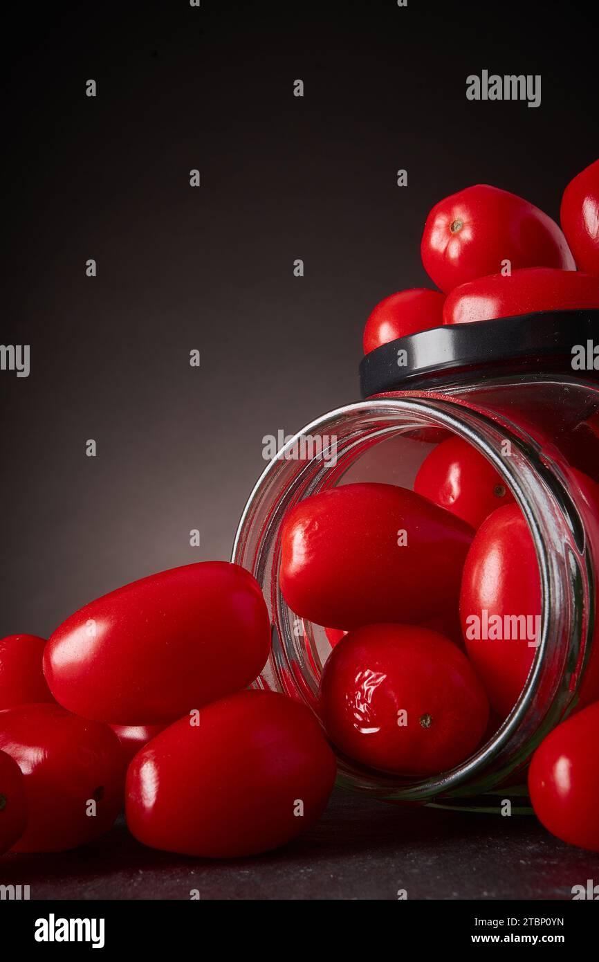 Grape tomatoes in a glass jar Stock Photo Alamy