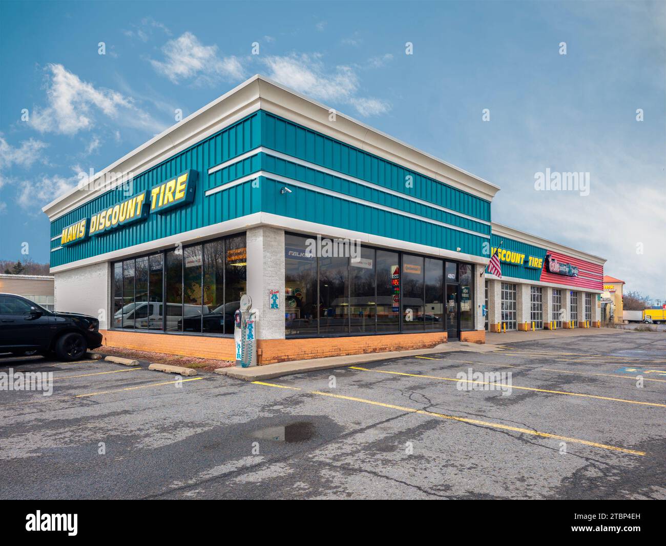 New York Mills, NY - Nov 23, 2023: Mavis Discount Tire is a well-known tire retailer in the US, offers a wide selection of tires with over 1000 locati Stock Photo