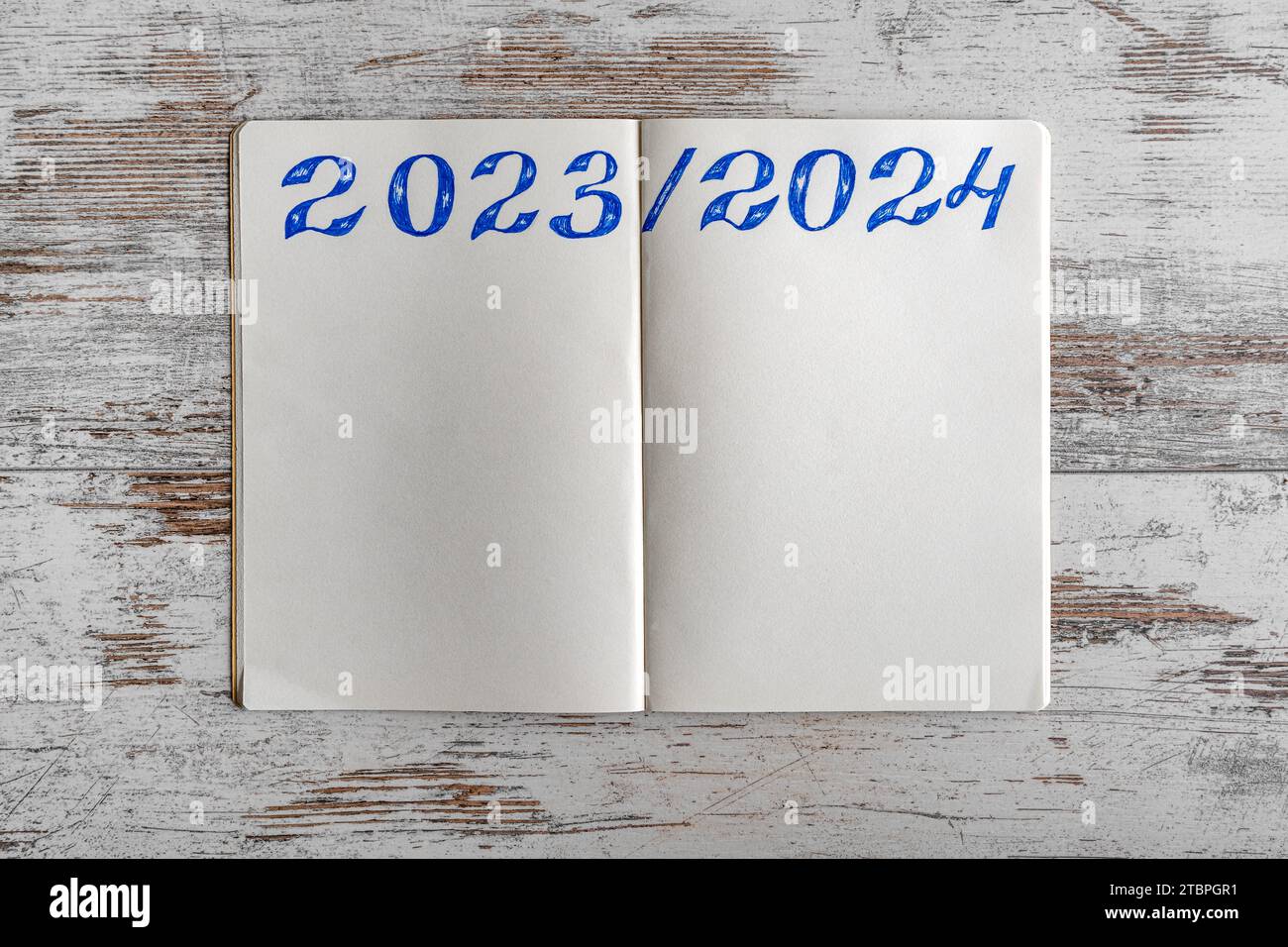 Notepad with dates 2023 and 2024. Stock Photo