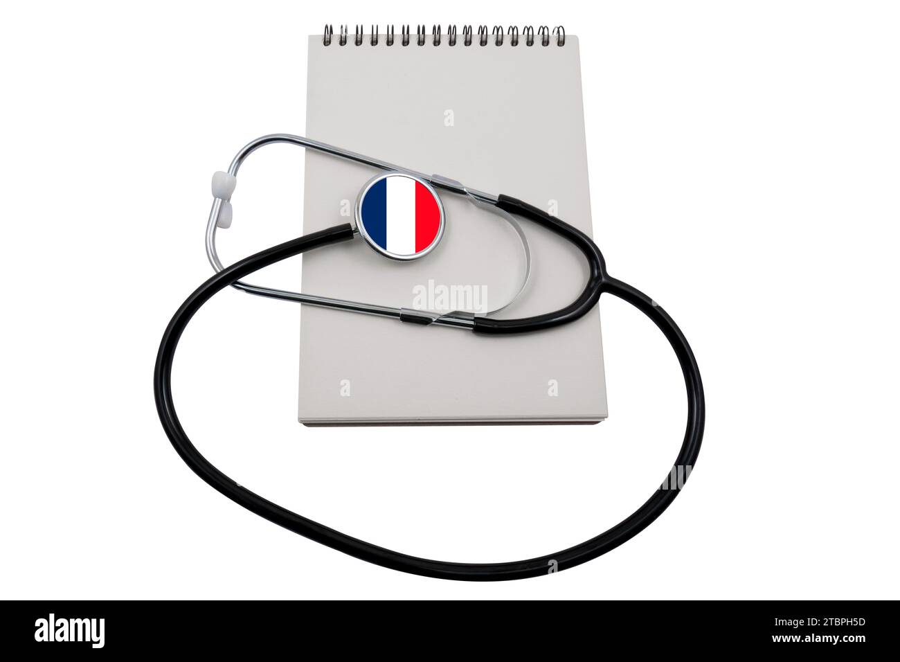 Stethoscope with a head in the form of the flag of France and a blank notepad, isolated on a