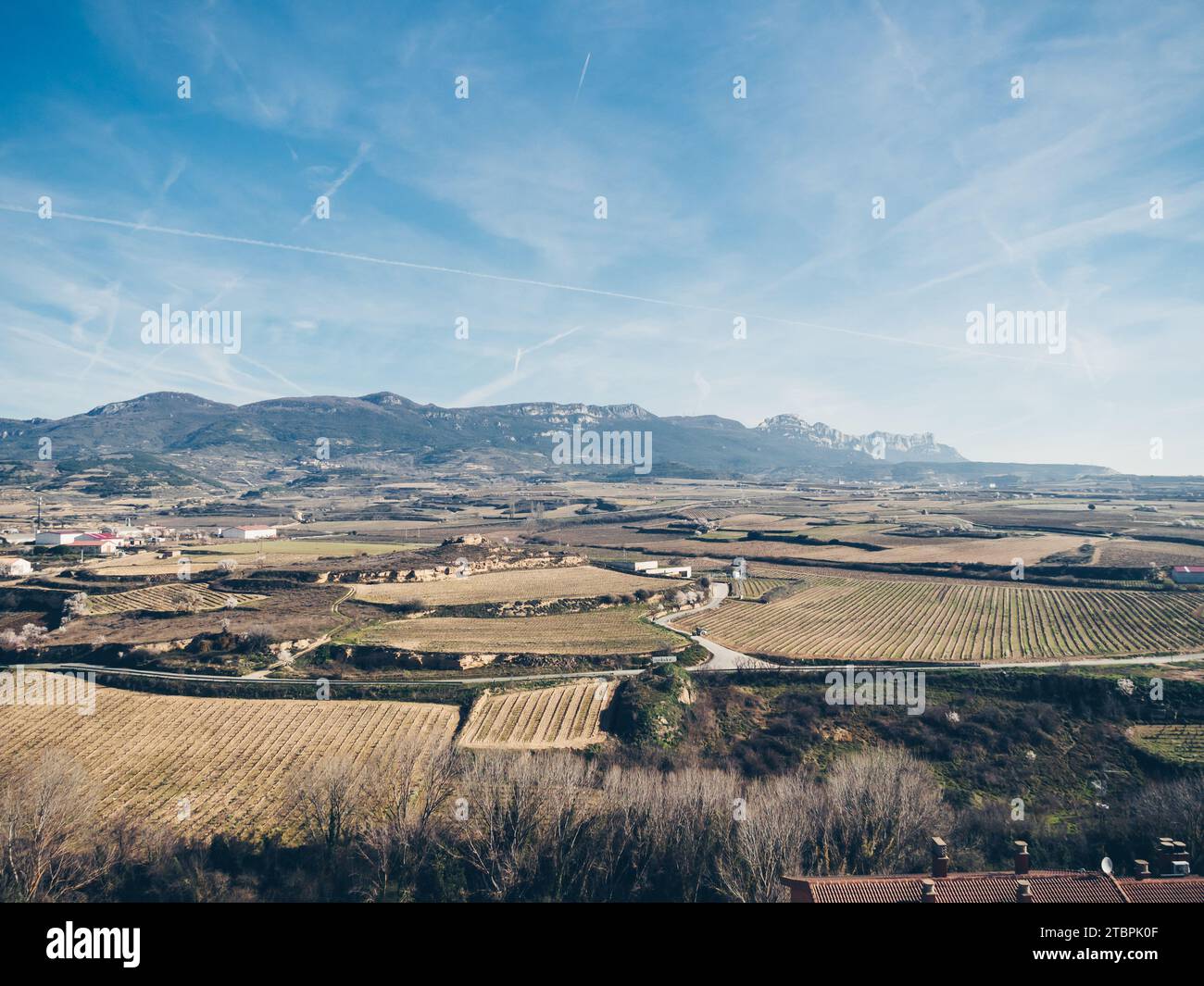 A picturesque small town nestled in a mountainous valley surrounded by ...