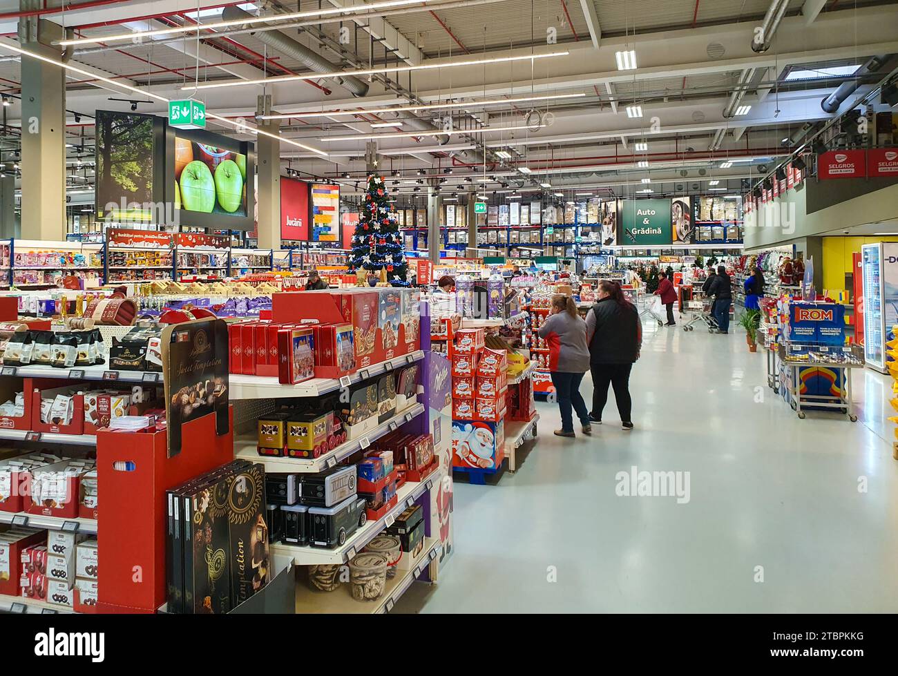 A supermarket with an array of food items on display in a variety of ...