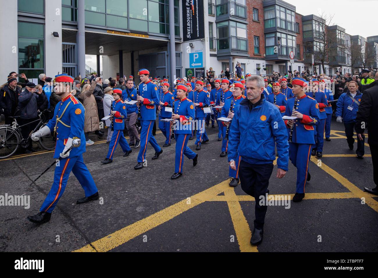 Members of the Artane Band lead the funeral procession of Shane MacGowan from Shelbourne Park Stadium as it makes its way through the streets of Dublin ahead of his funeral in Co Tipperary. The songwriter, who found fame as the lead singer of London-Irish punk/folk band The Pogues, died at the age of 65 last week. Picture date: Friday December 8, 2023. Stock Photo