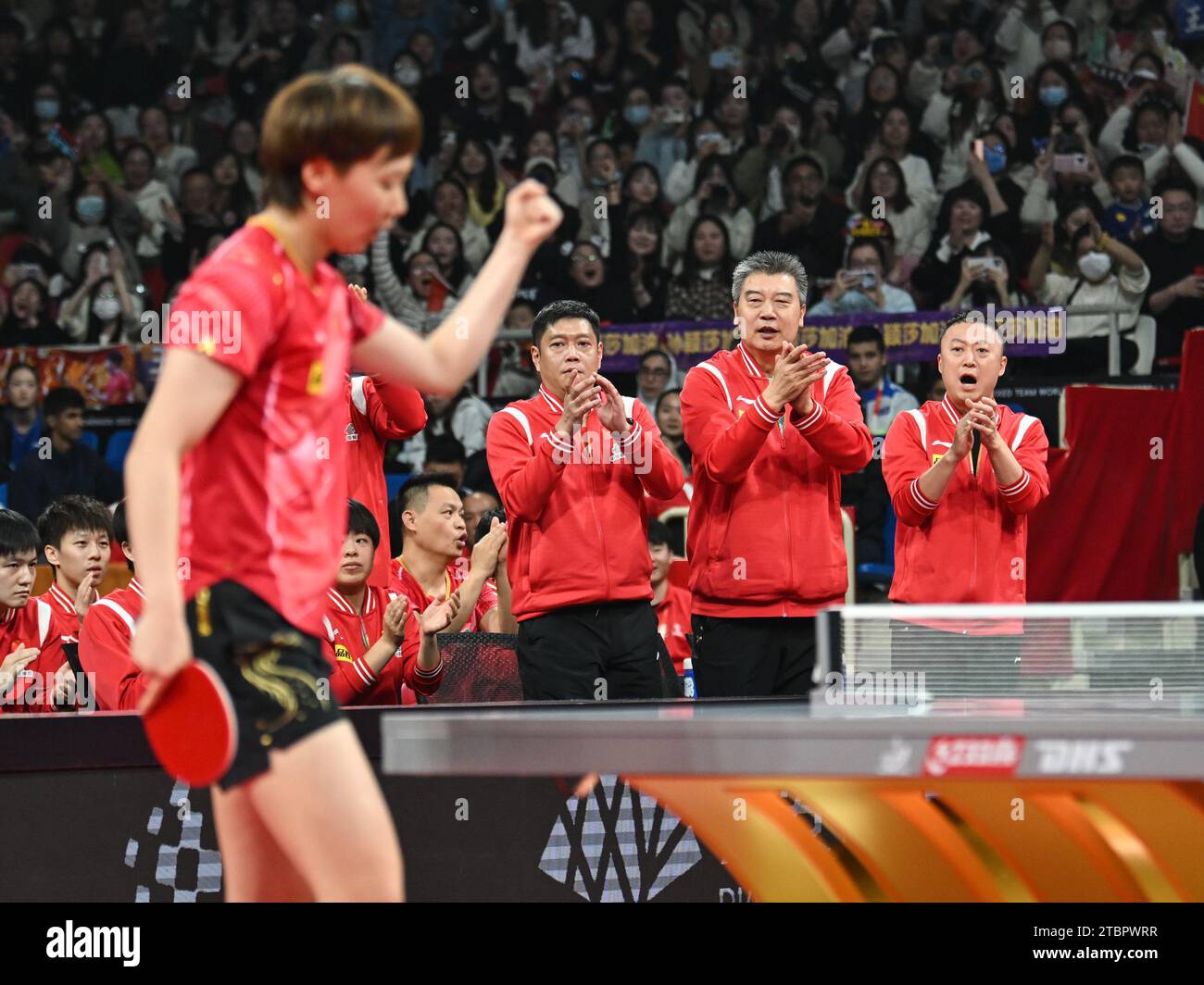 Chengdu, China's Sichuan Province. 8th Dec, 2023. Coach Li Sun (2nd R ...