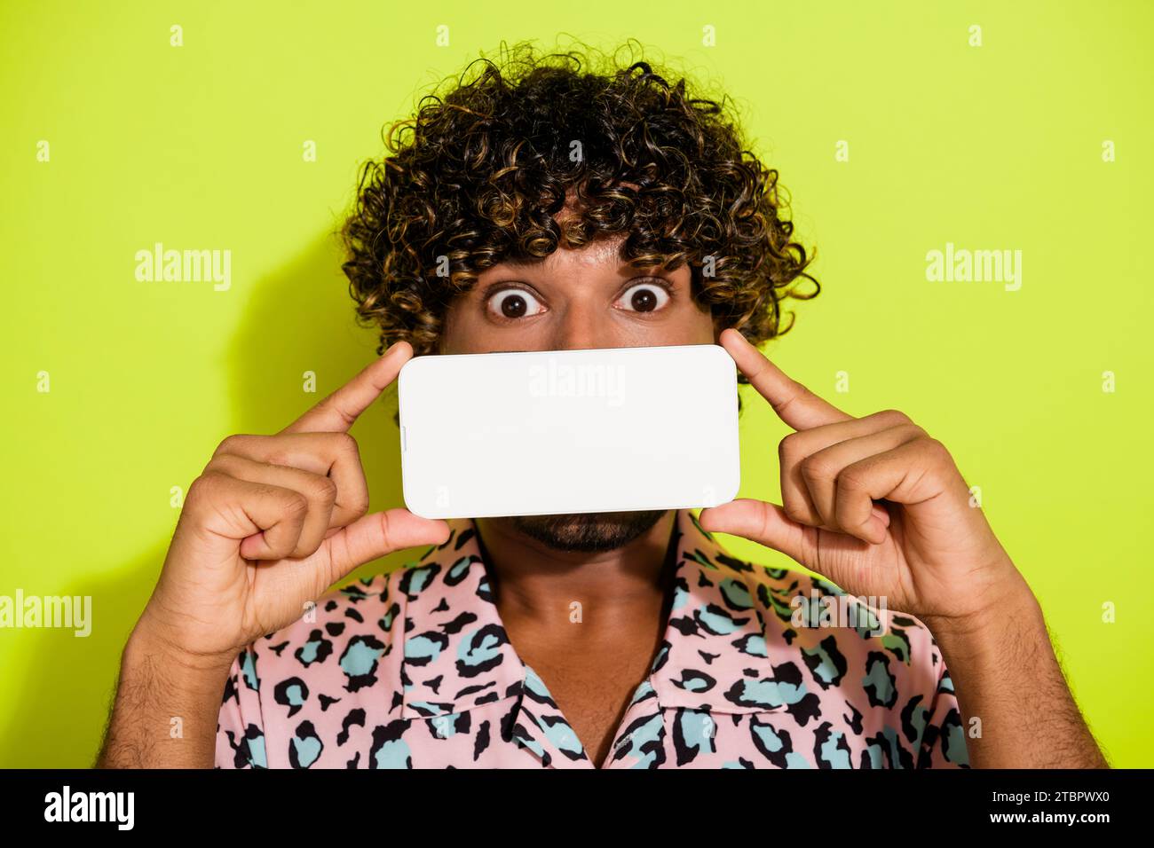 Photo portrait of attractive young man gadget cover mouth screen wear