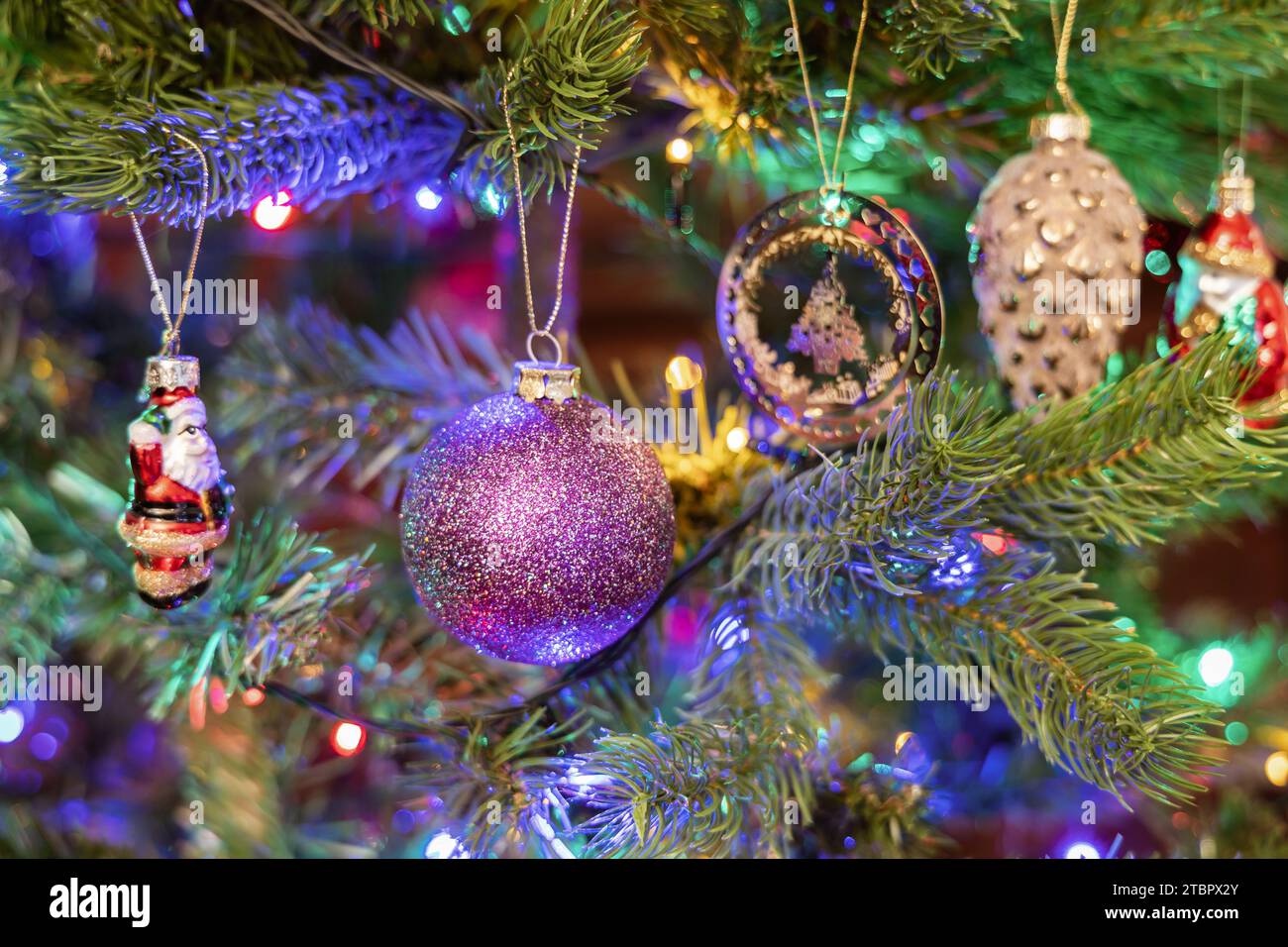 Christmas tree decorated with balls and gerland Stock Photo - Alamy