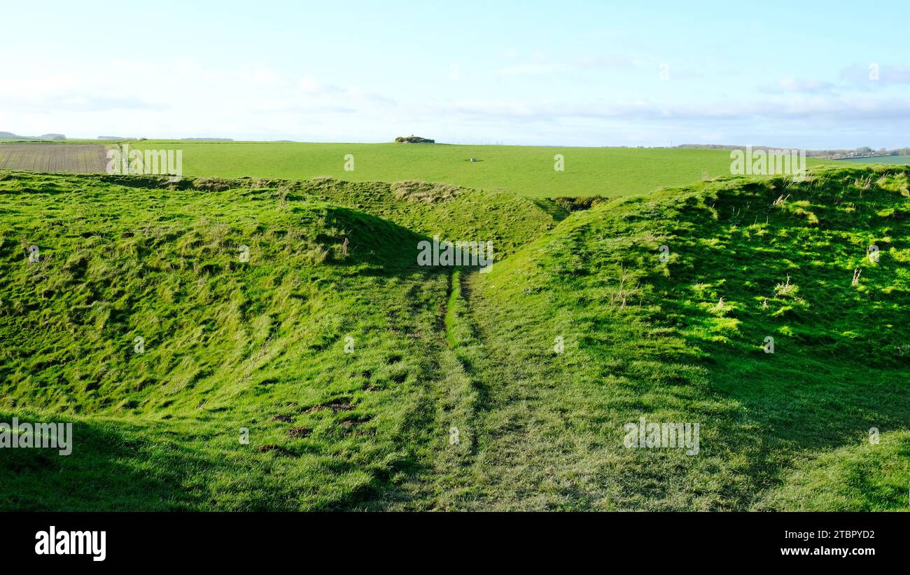 The defensive ditches at the iron age hill fort of Maiden Castle. The largest in the UK - John Gollop Stock Photo