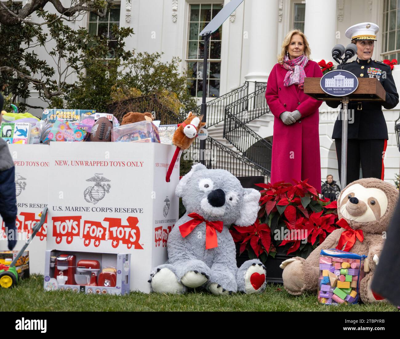 Washington, United States. 06th Dec, 2023. U.S. First Lady Jill Biden, left, looks on as U.S. Marine Corps Brig. Gen. Valerie Jackson, right, commanding general of 4th Marine Logistics Group, Marine Forces Reserve delivers remarks during a Toys for Tots event hosted at the White House, December 6, 2023 in Washington, DC Each year, the Marine Corps collects and distributes 8 million toys for children in 830 communities nationwide. Credit: Cpl. Ryan Schmid/U.S Marine Corps Photo/Alamy Live News Stock Photo