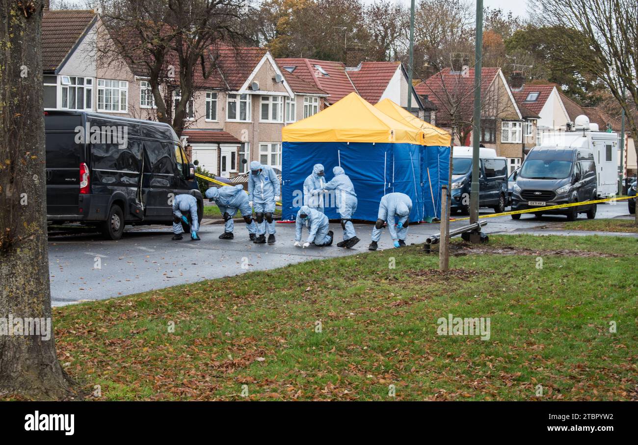 Police forensic team investigate site of an explosion that damaged a ULEZ traffic control camera