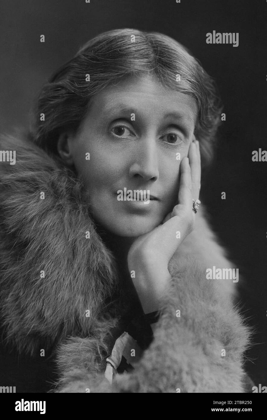 Photograph of Virginia Woolf with hand on face wearing a fur stole circa 1927. Stock Photo