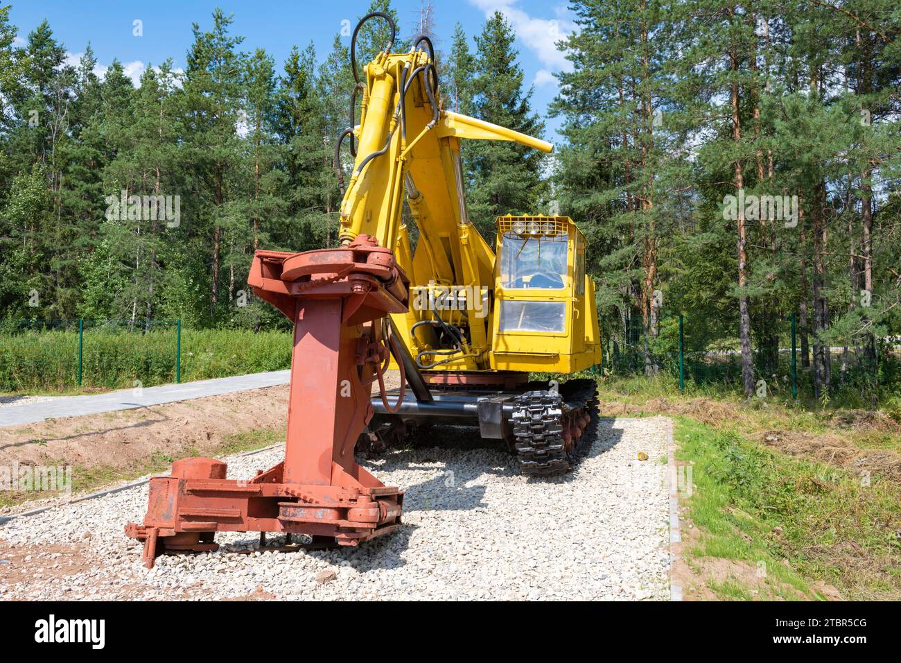 SHARYA, RUSSIA - AUGUST 07, 2022: Feller buncher machine on a caterpillar chassis on a sunny summer day. Forest Museum Stock Photo