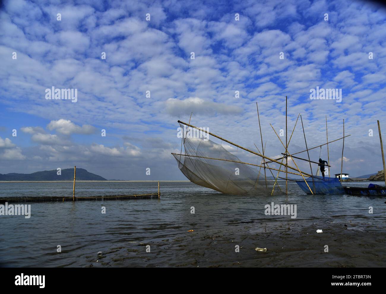 Guwahati, Guwahati, India. 8th Dec, 2023. A fisherman spread his fishing net in river