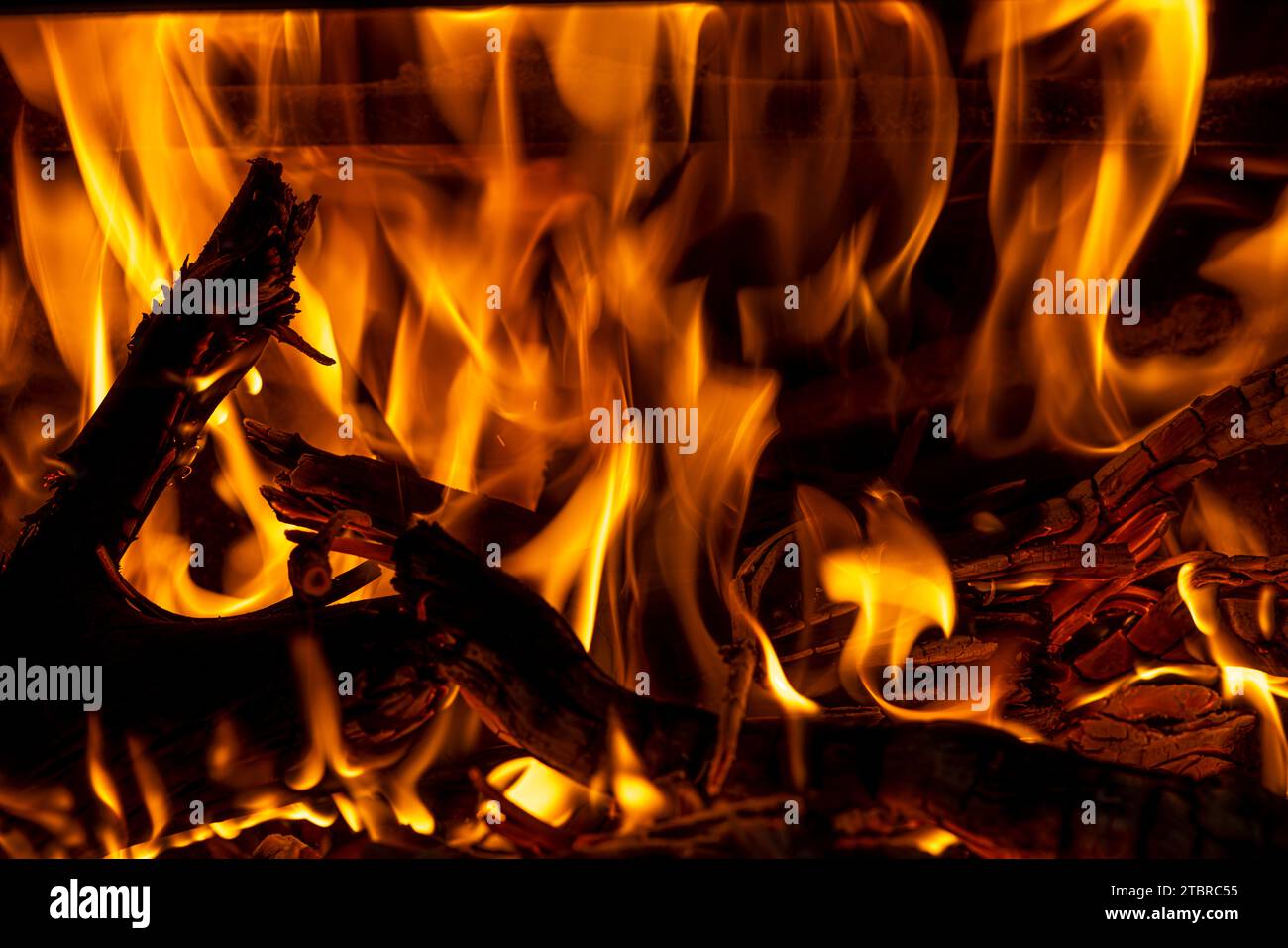 Burning open fire in a wood-burning stove Stock Photo