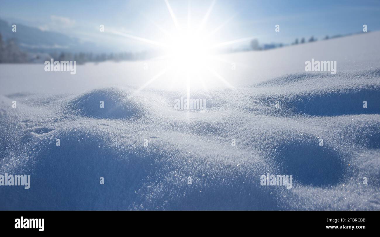 Sunbeams over a snowfield Close-up Stock Photo